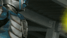 a close up of a person 's armor with a yellow object behind them