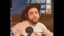 a man wearing headphones and a hat with the name electricrob on the screen