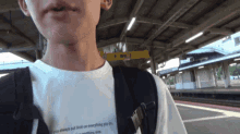 a man wearing a t-shirt that says " if you always put limits on everything you do "