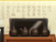 a blurry picture of a table with bottles and a box