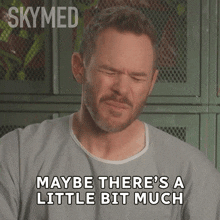 a man with his eyes closed says " maybe there 's a little bit much " on a screen