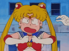 a cartoon of sailor moon with a very angry look on her face .