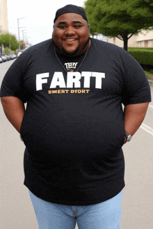 a man wearing a black shirt with the word fartt on it