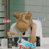 a woman is eating noodles with chopsticks next to a can of pepsi