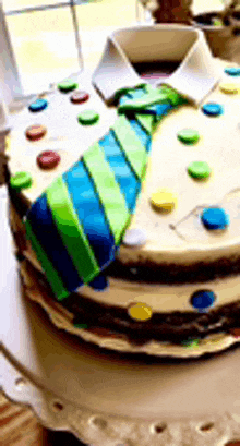a cake that has a tie on it