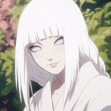 a girl with white hair and blue eyes is standing in front of a tree .