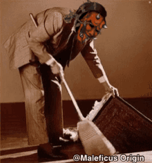 a man in a suit with a mask on his face is cleaning a box with a broom ..