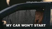a woman sitting in a car with the words my car won 't start