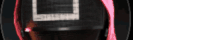 a blurry picture of a person wearing a mask with a pink ribbon around their head .
