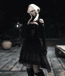 a woman in a black dress is standing on a wooden floor