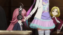 a group of anime girls are standing next to each other in a classroom holding hands .