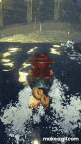 a video game character is riding a jet ski in the water .