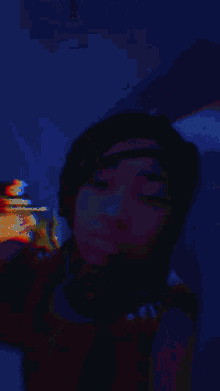 a blurry photo of a woman 's face with a red background