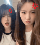 two girls are standing next to each other and one of them is making a funny face .