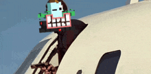 a man holding a gun with a pixelated face on his head while sitting on a plane