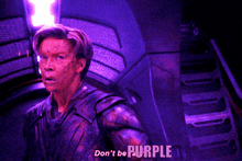 a man with purple paint on his face says " don 't be a purple "