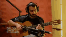a man wearing headphones is playing a guitar with the words malei matu " cuando " on the bottom