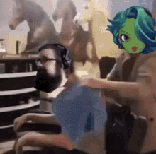 a man with a beard and headphones is being massaged by a woman with a green face