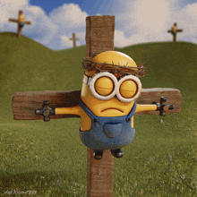 a minion with a crown of thorns is tied to a cross