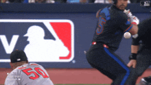 a baseball player with the number 50 on his shirt