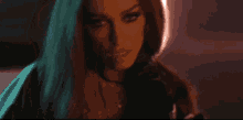 a pixelated image of a woman 's face with a dark background
