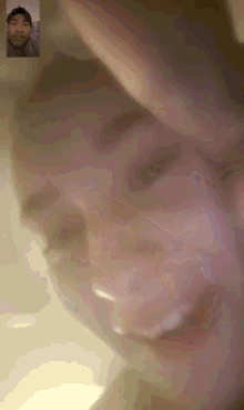 a man and woman are on a video call and the woman is smiling
