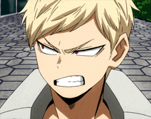a close up of a man 's face with an angry look on it