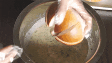 Dipping The Bread Two Plaid Aprons GIF - Dipping The Bread Two Plaid Aprons Putting Bread In A Bowl Of Garlic Butter GIFs