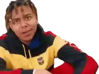 a man wearing a yellow and red jacket is making a face