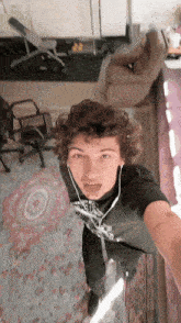 a man taking a selfie in a living room