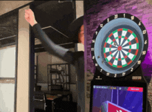 a dart board with a score of 88100 on the screen