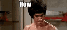bruce lee is making a funny face while holding a knife in a locker room .