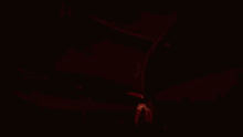 a cartoon spider is crawling on a red surface