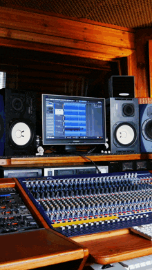 a yamaha monitor sits on top of a mixer