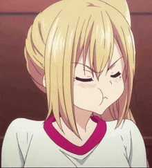 a girl with blonde hair and a red collar is making a funny face