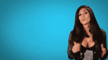 a woman stands in front of a blue background with the words watch the lesson absorb the info