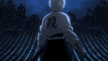 a man is holding a sword with chinese characters on his back