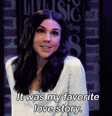 a woman says " it was my favorite love story " while smiling