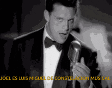 a man in a tuxedo singing into a microphone with the words joel es luis miguel de constellation musical