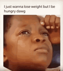 a little boy is crying with a caption that says i just wanna lose weight but i be hungry dawg .