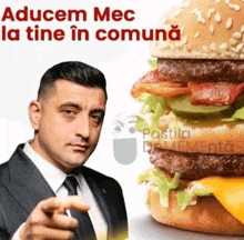 a man in a suit is pointing at a hamburger with the words " aducem mec la tine in comuna "