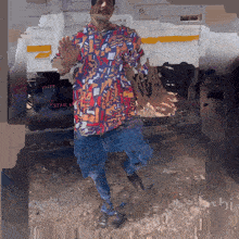 a man stands in front of a truck that says kutt on it