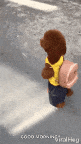 a teddy bear wearing a yellow vest and carrying a pink backpack is walking down a street ..