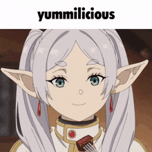 a picture of a girl with pigtails and the words yummilicious above her