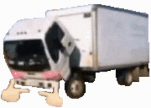 a white truck with a pink stripe on the side is giving a thumbs up