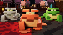 three frogs are sitting next to each other in a video game .