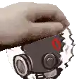 a hand is holding a cartoon character with red eyes and a red nose .