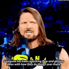 a wrestler is talking into a microphone and says someone has been watching raw and getting ideas
