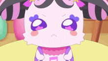 a pink and black cartoon character with a star on her hair