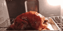 a roasted turkey is sitting on a tray in an oven